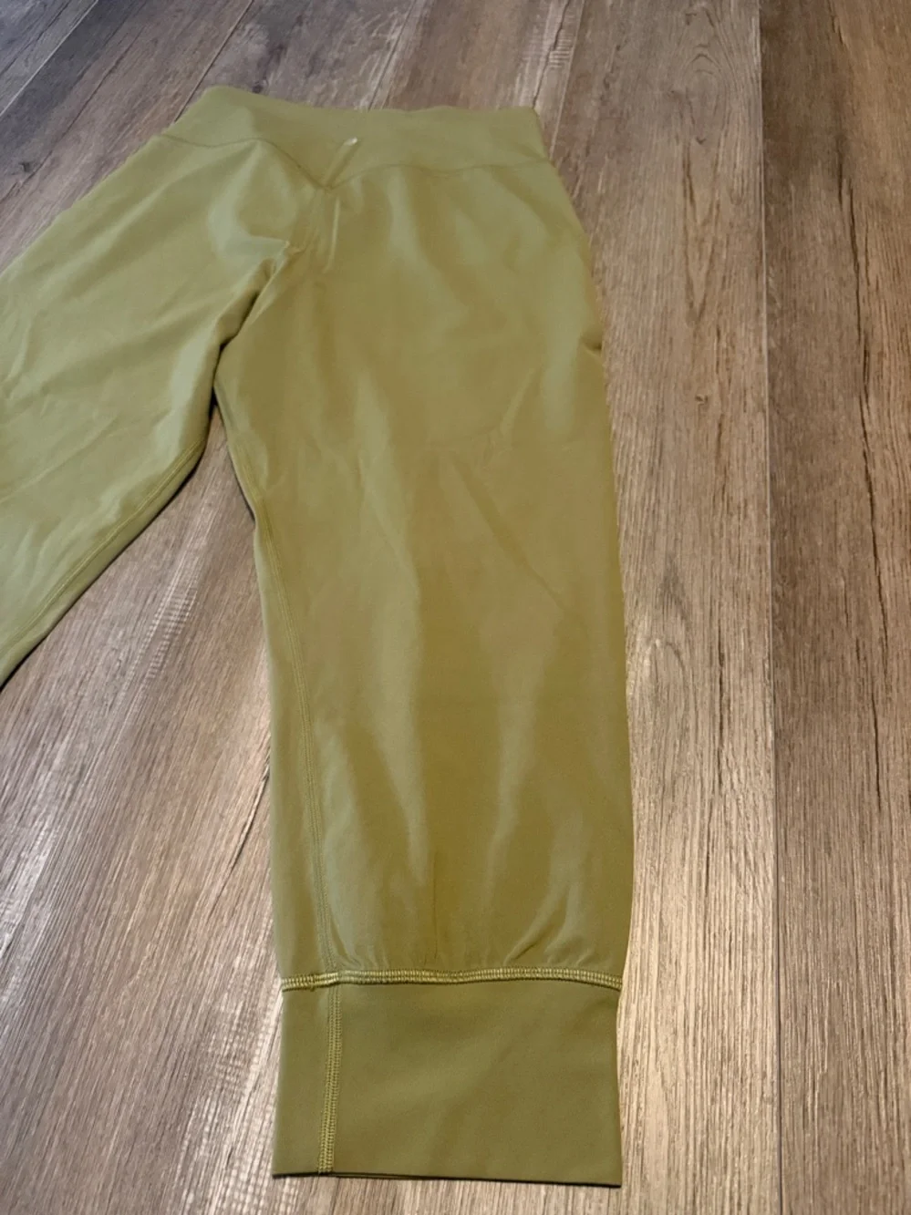 Lululemon Align High-Rise Cropped Jogger Capris in a bronze green color.
